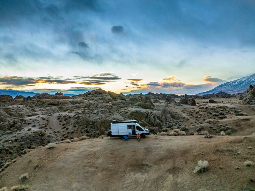 Serene sunset view of a camper van in the Alabama Hills, California.