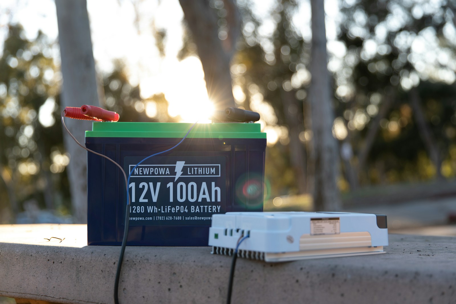 a battery and a charger sitting on a ledge
